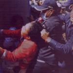 Municipal security guards fore a woman into a police van on 1 February 2012